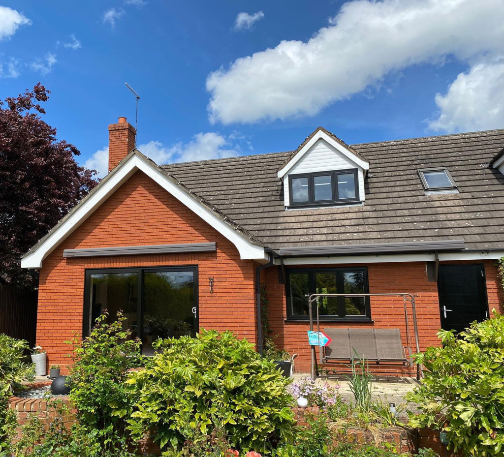 Black flush casement windows on exterior of home